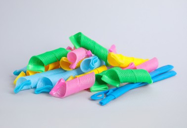 Photo of Many different hair curlers on white background