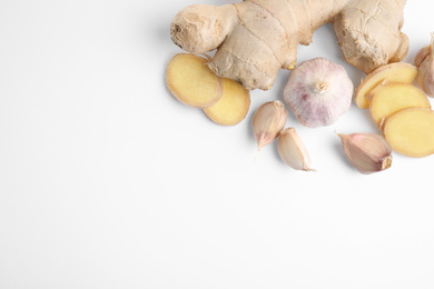 Photo of Fresh garlic and other natural cold remedies isolated on white, top view