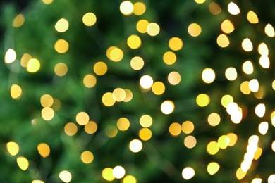 Photo of Abstract background with blurred yellow Christmas lights, bokeh effect