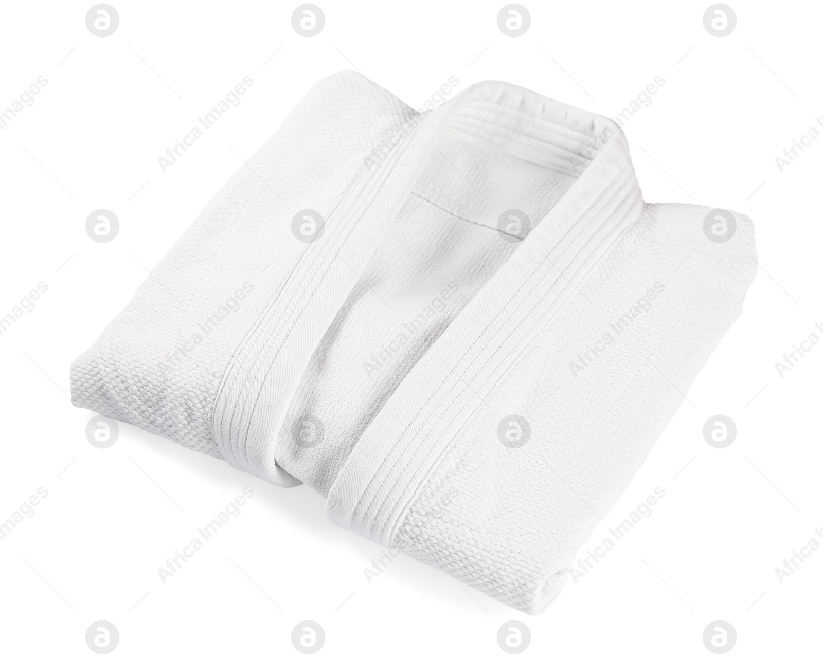 Photo of Folded kimono isolated on white. Martial arts uniform