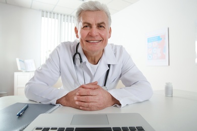 Doctor consulting patient using video chat in clinic, view from web camera