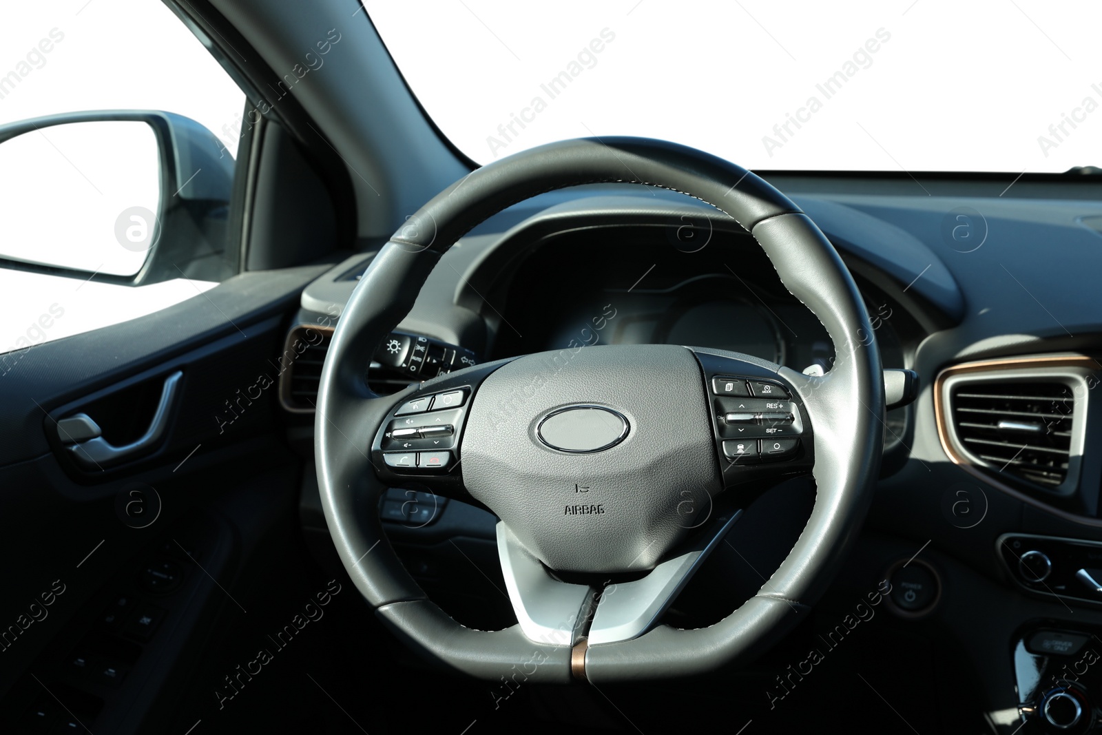 Image of Steering wheel and dashboard in modern car isolated on white