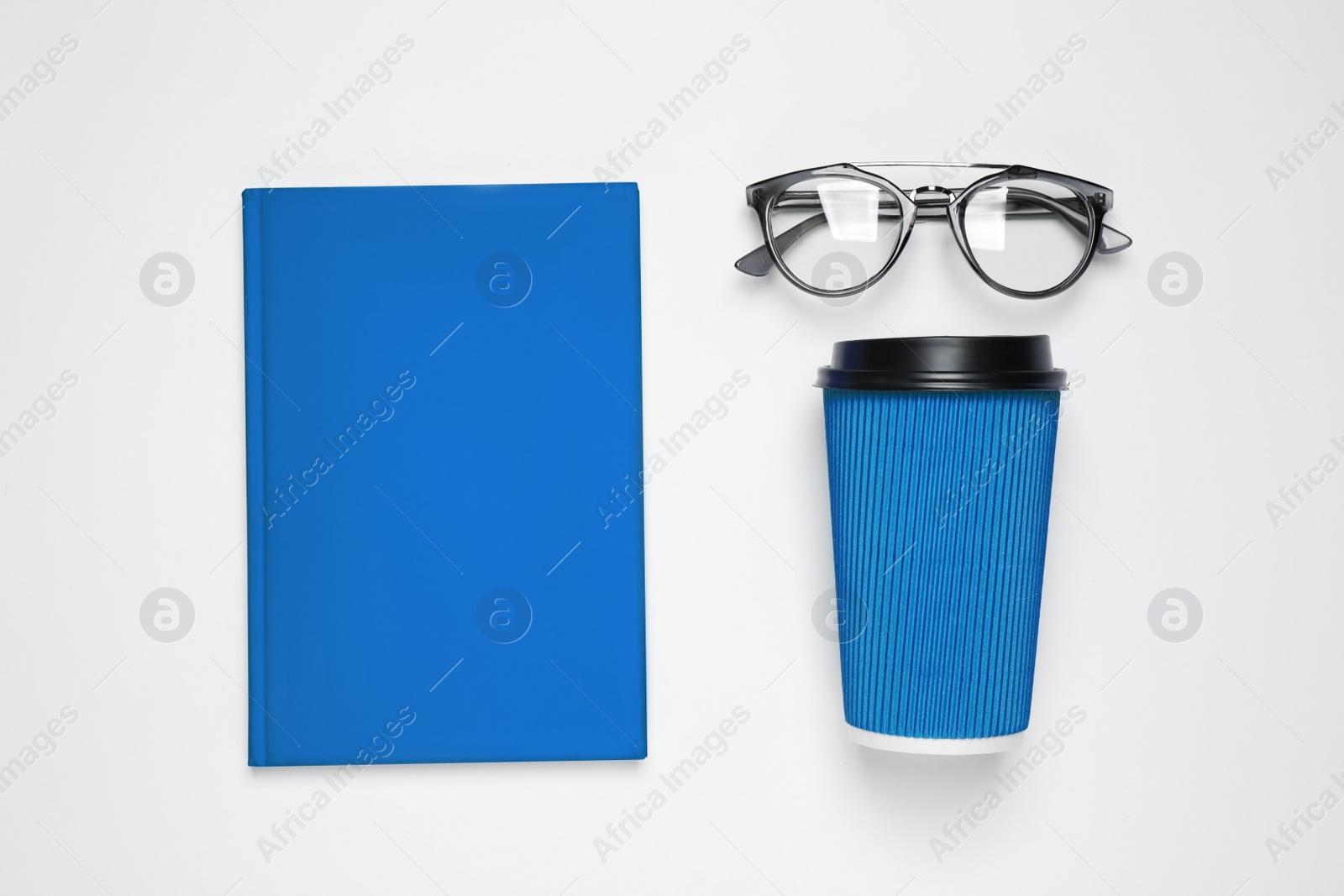 Photo of Flat lay composition inspired by color of the year 2020  (Classic blue) on white background