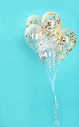 Photo of Bunch of bright balloons on color background