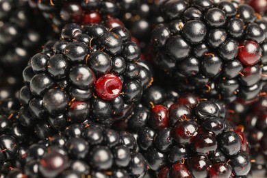 Photo of Many tasty ripe blackberries as background ,closeup
