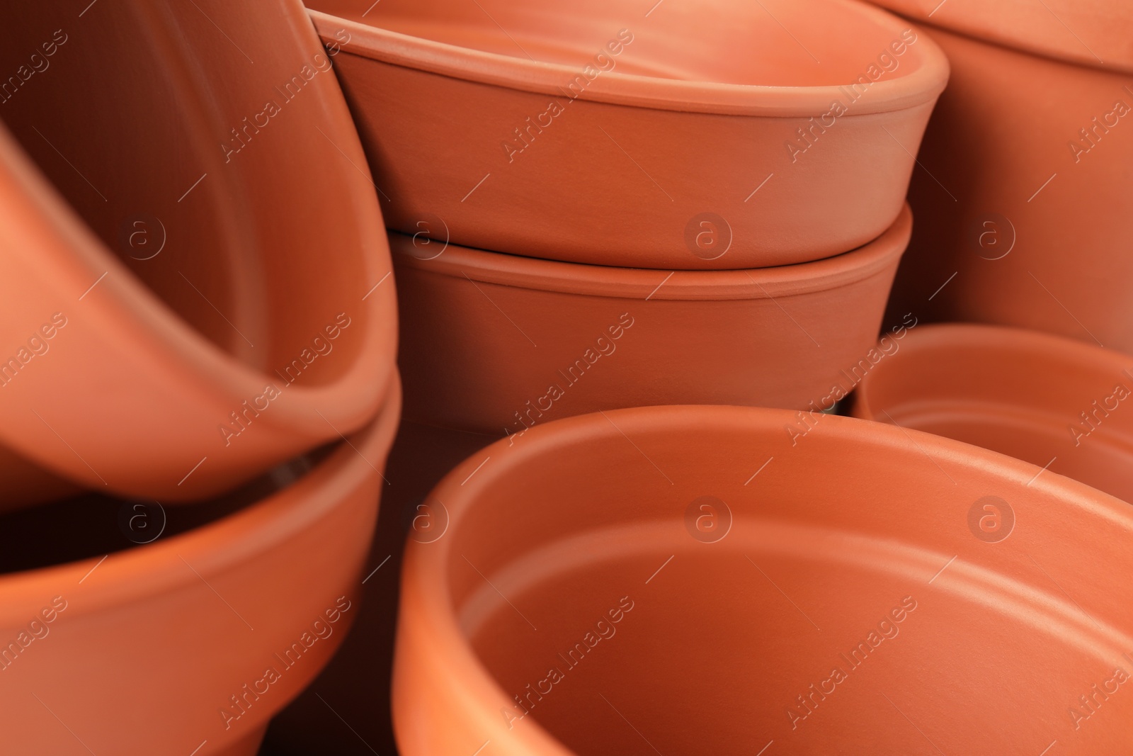 Photo of Many clay flower pots as background, closeup