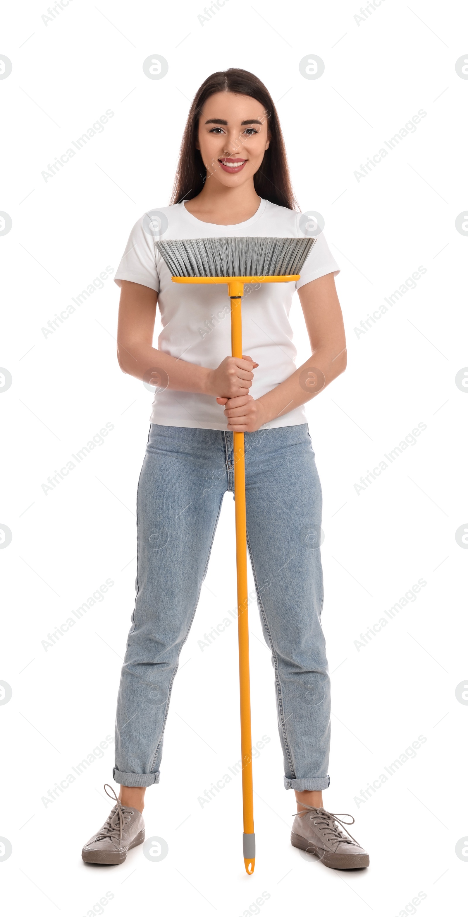 Photo of Beautiful young woman with broom on white background