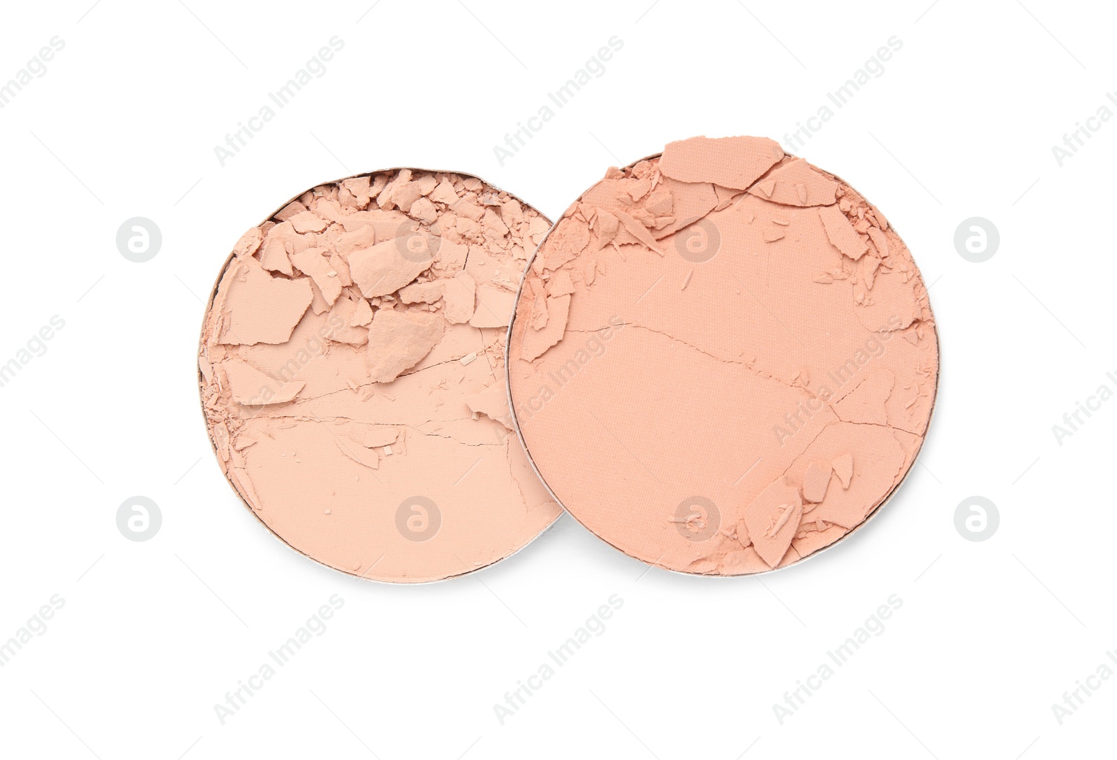 Photo of Different broken face powders on white background, top view