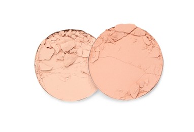 Photo of Different broken face powders on white background, top view