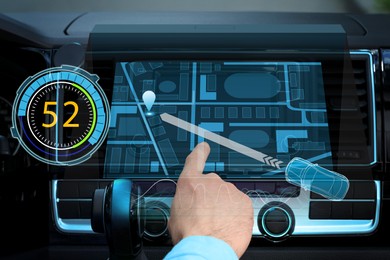 Image of Driver using modern car navigation system, closeup