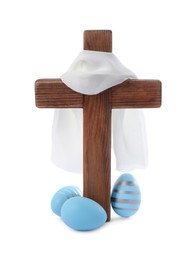 Photo of Wooden cross, cloth and painted Easter eggs on white background