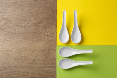 Photo of Miso soup spoons on table, flat lay. Space for text