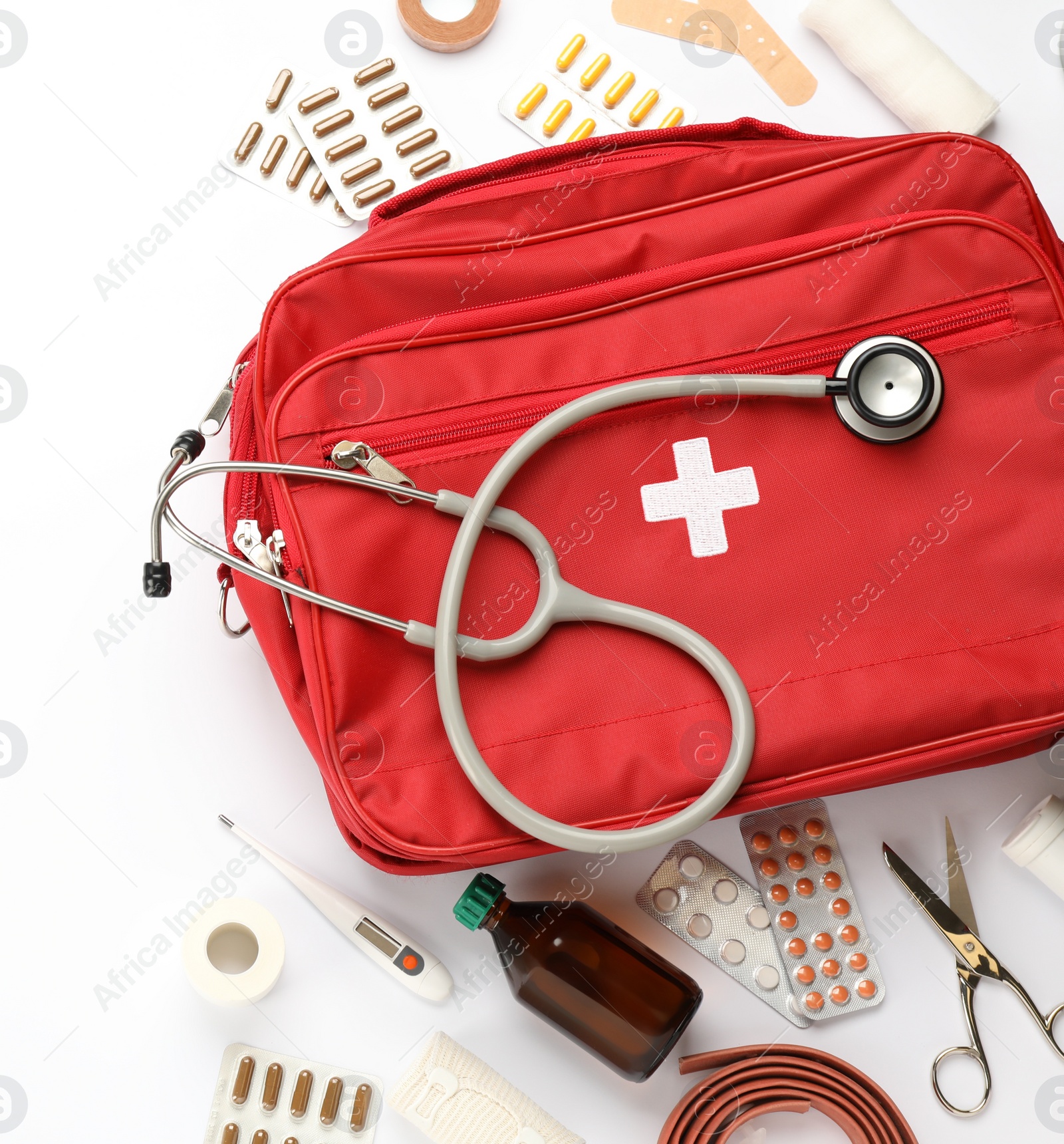 Photo of Flat lay composition with first aid kit on white background