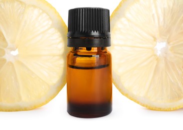 Photo of Bottle of citrus essential oil and fresh lemon isolated on white
