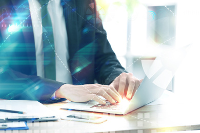 Image of Double exposure of man working on laptop in office and graph, closeup. Digital marketing concept 