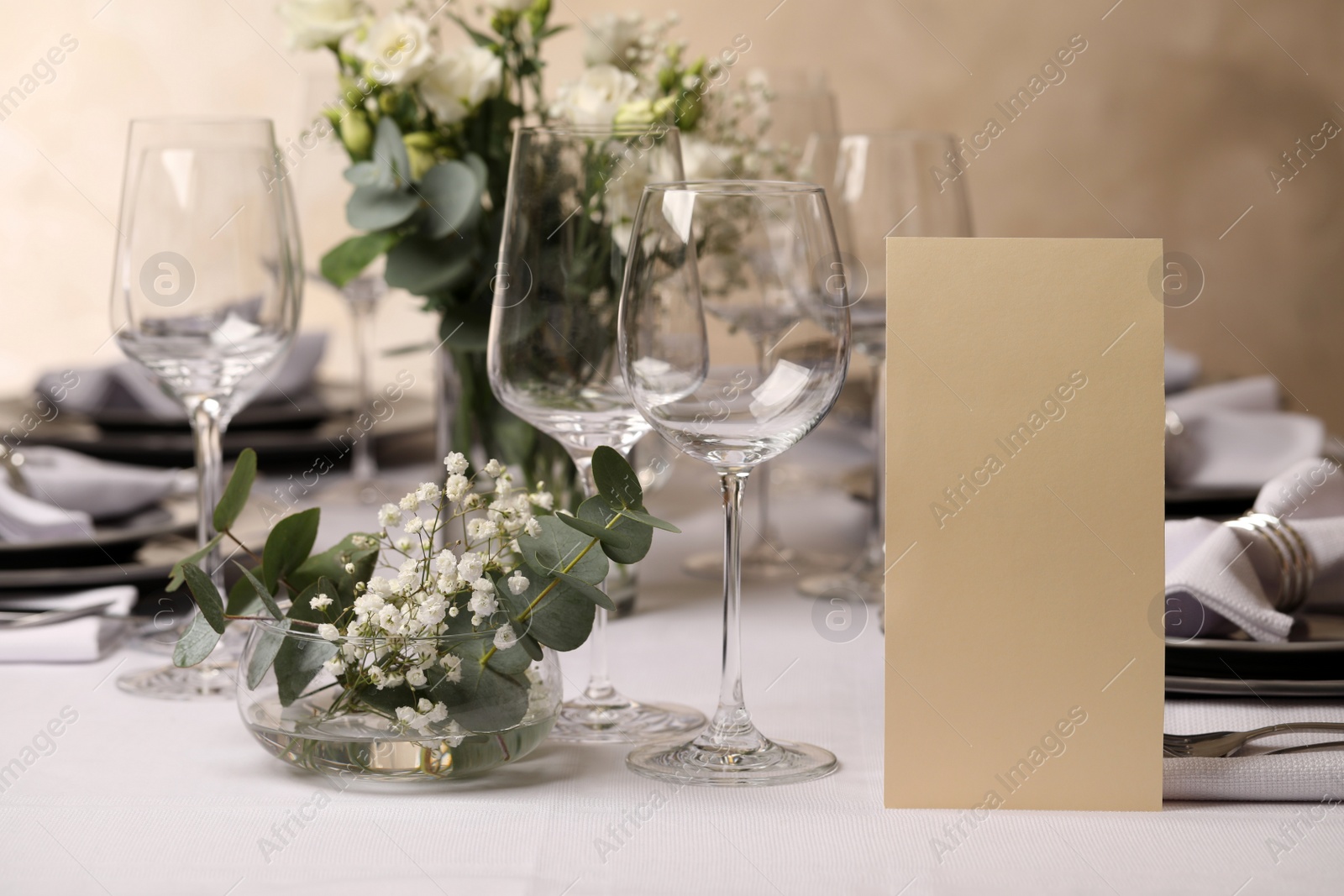 Photo of Stylish elegant table setting for festive dinner in restaurant