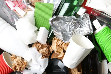 Photo of Pile of different garbage as background, top view. Recycling problem