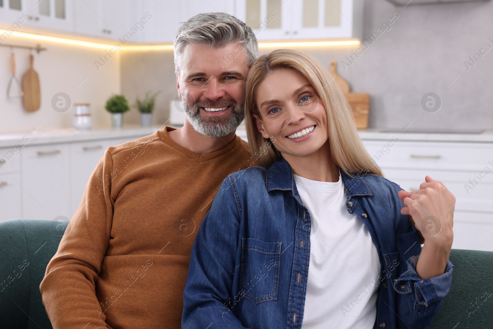 Photo of Portrait of happy affectionate couple at home. Romantic date