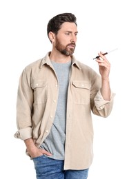 Photo of Man using cigarette holder for smoking isolated on white