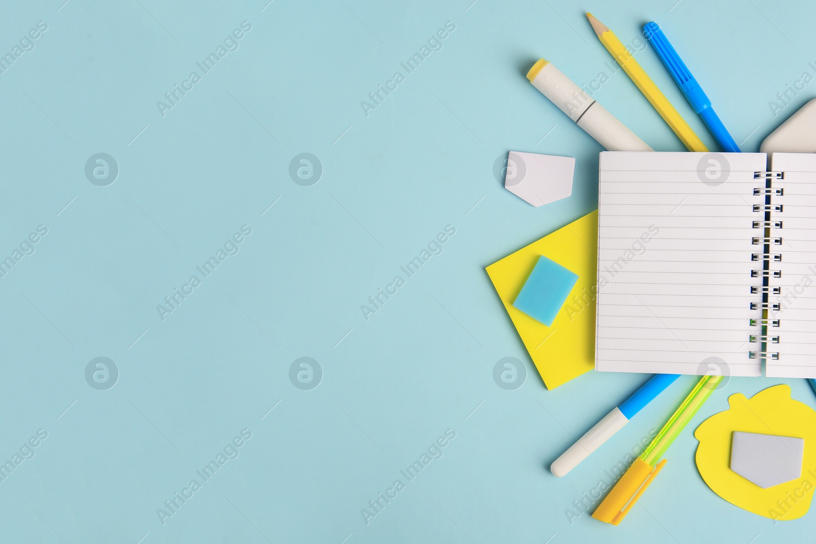 Photo of Different school stationery on light blue background, flat lay with space for text. Back to school