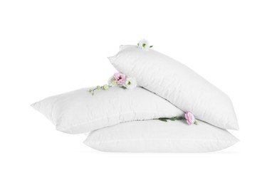 Photo of Soft pillows with beautiful flowers on white background