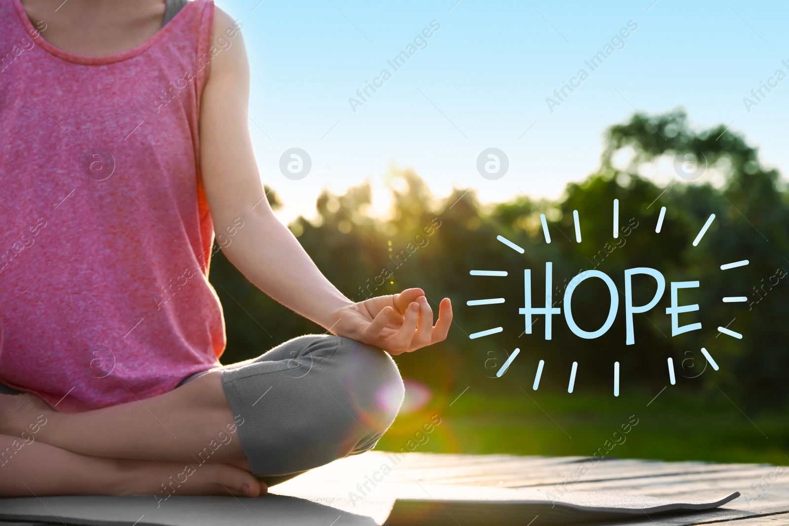 Image of Concept of hope. Young woman practicing yoga outdoors, closeup.