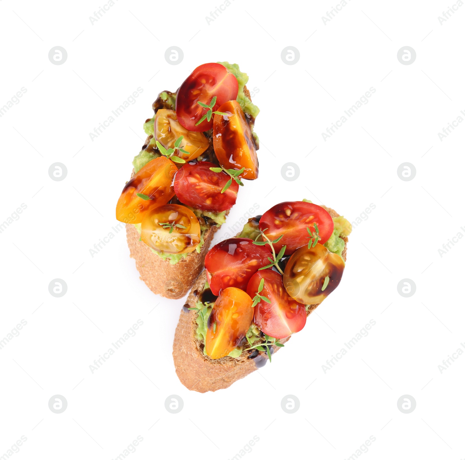 Photo of Delicious bruschettas with avocado, tomatoes and balsamic vinegar isolated on white, top view
