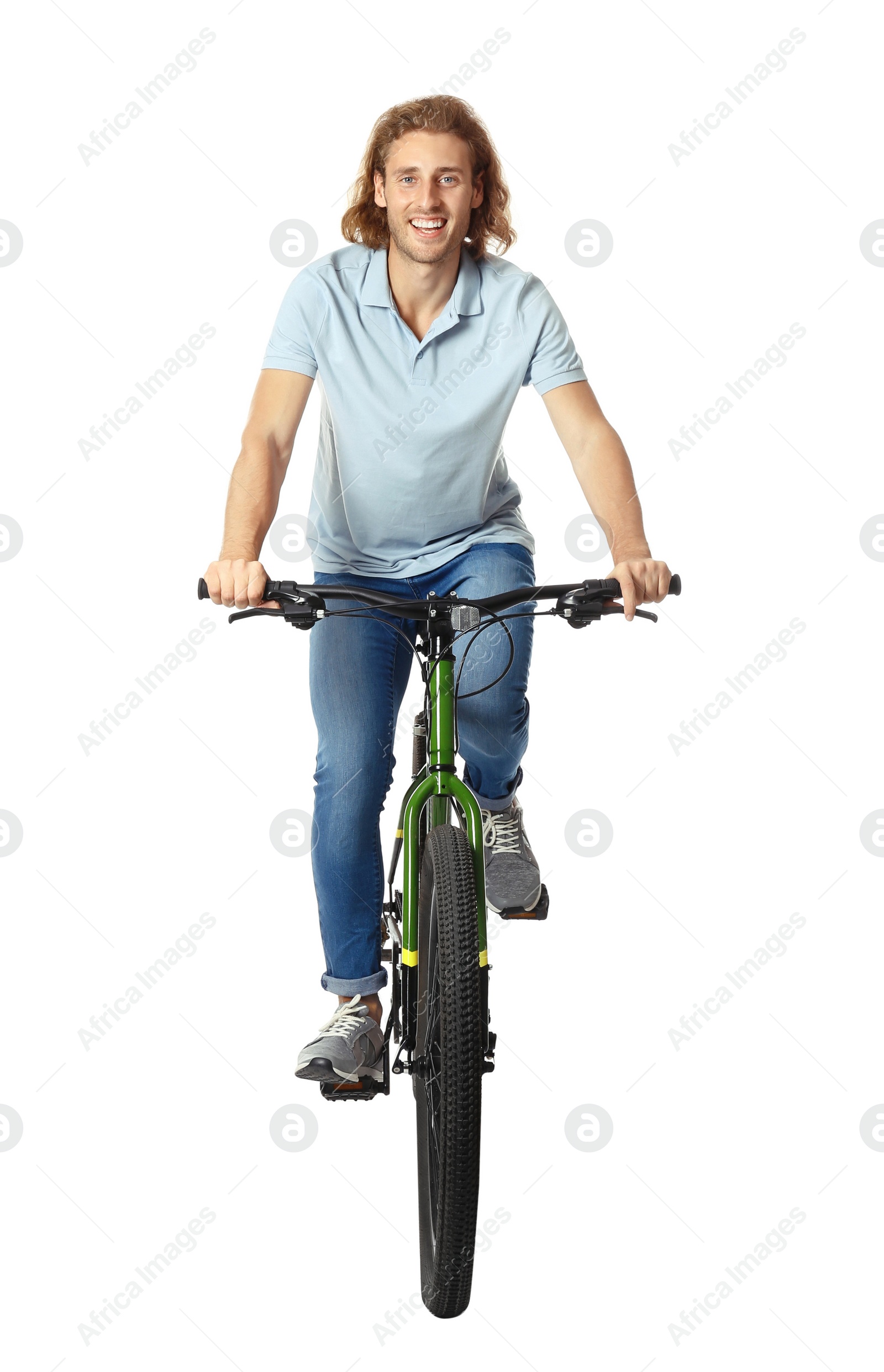 Photo of Happy young man riding bicycle on white background