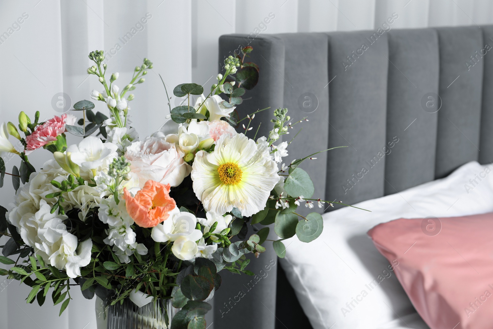 Photo of Bouquet of beautiful flowers in vase indoors, closeup