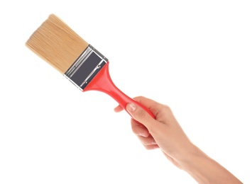 Photo of Woman holding paint brush on white background, closeup