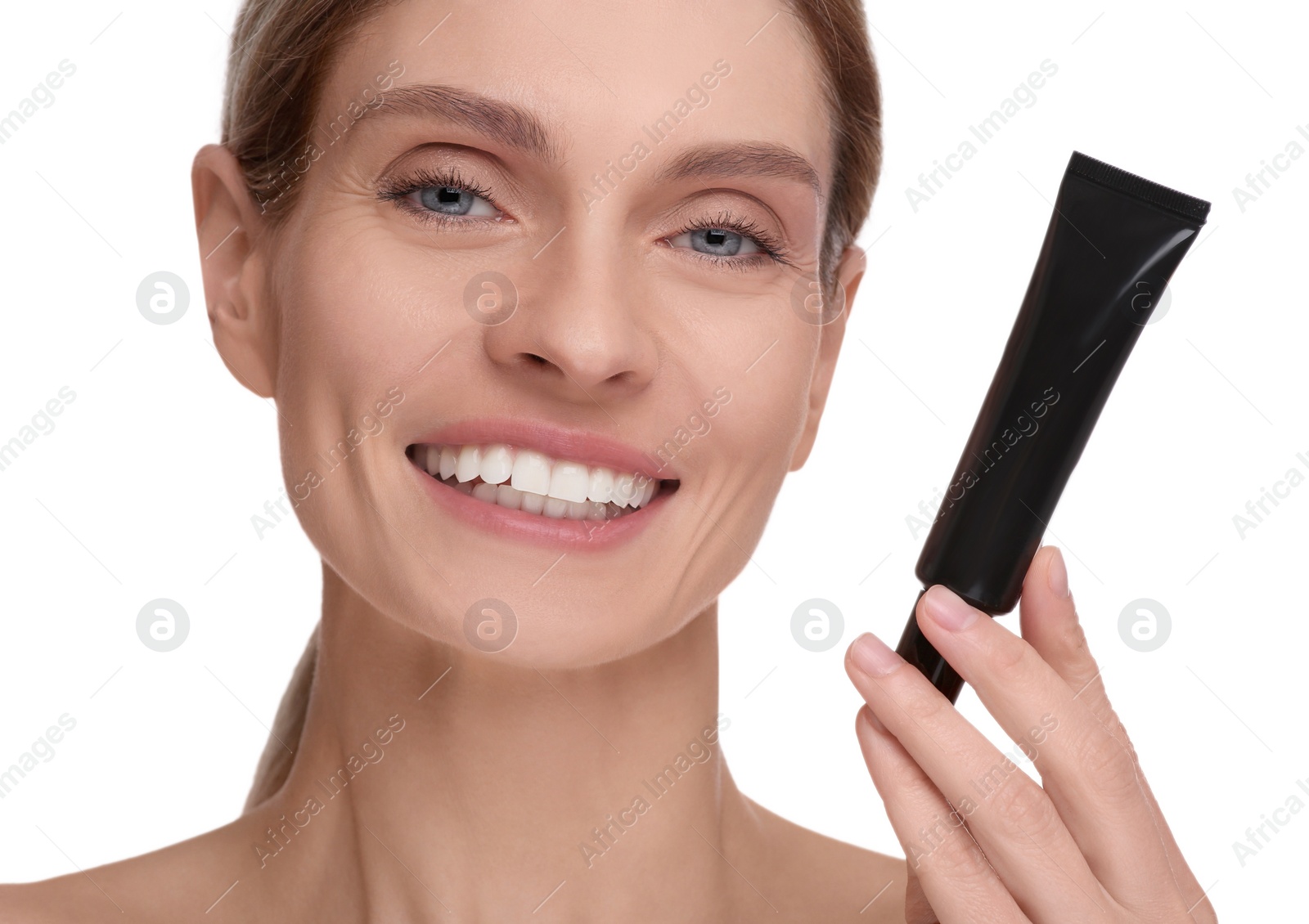 Photo of Woman holding tube with foundation on white background