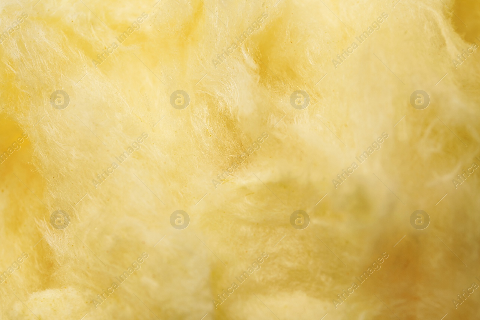 Photo of Fluffy yummy cotton candy as background, closeup