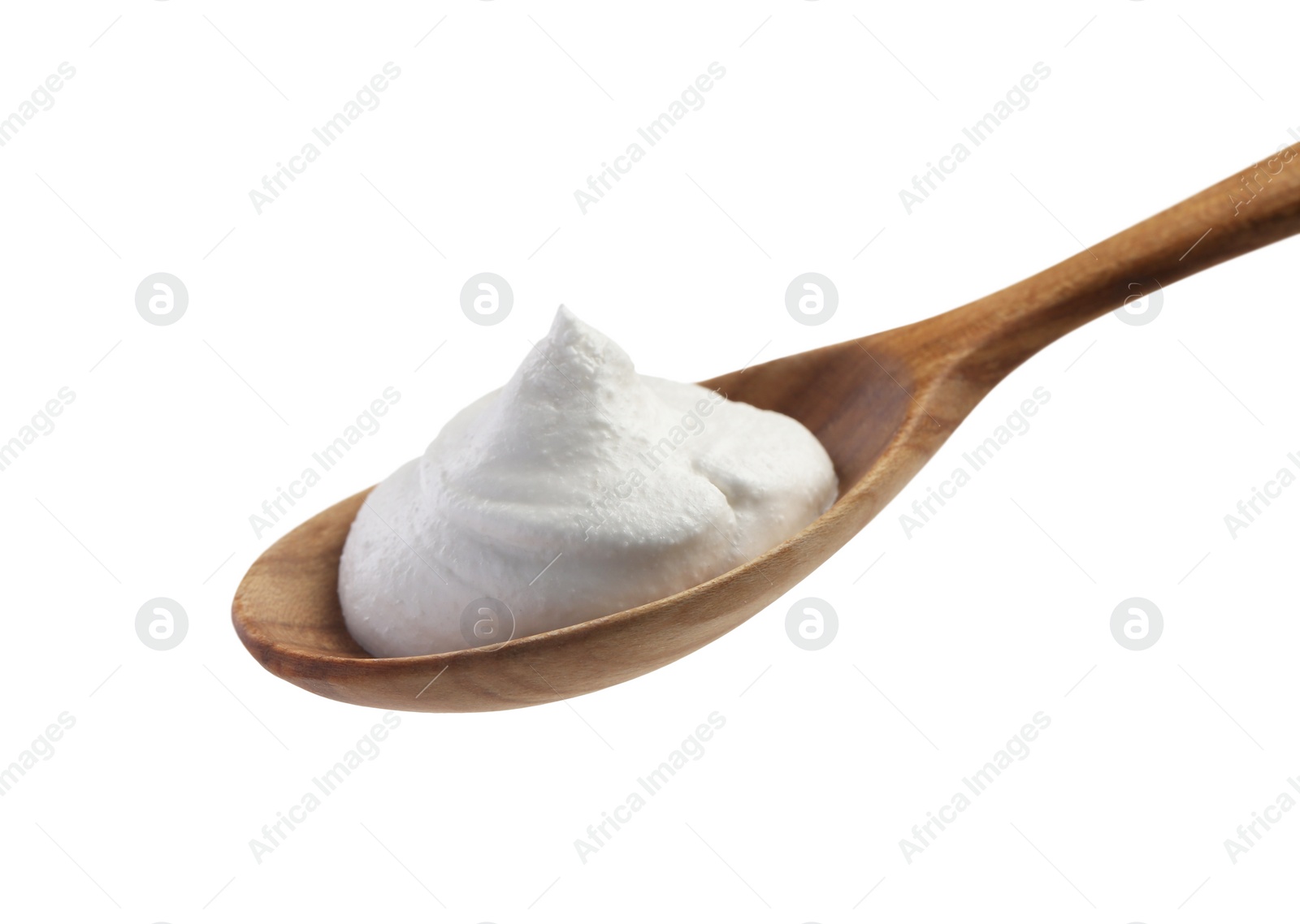 Photo of Wooden spoon with sour cream isolated on white