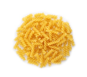 Uncooked fusilli pasta on white background, top view