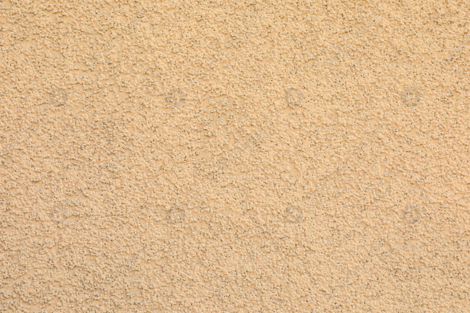 Photo of Texture of beige plaster wall as background