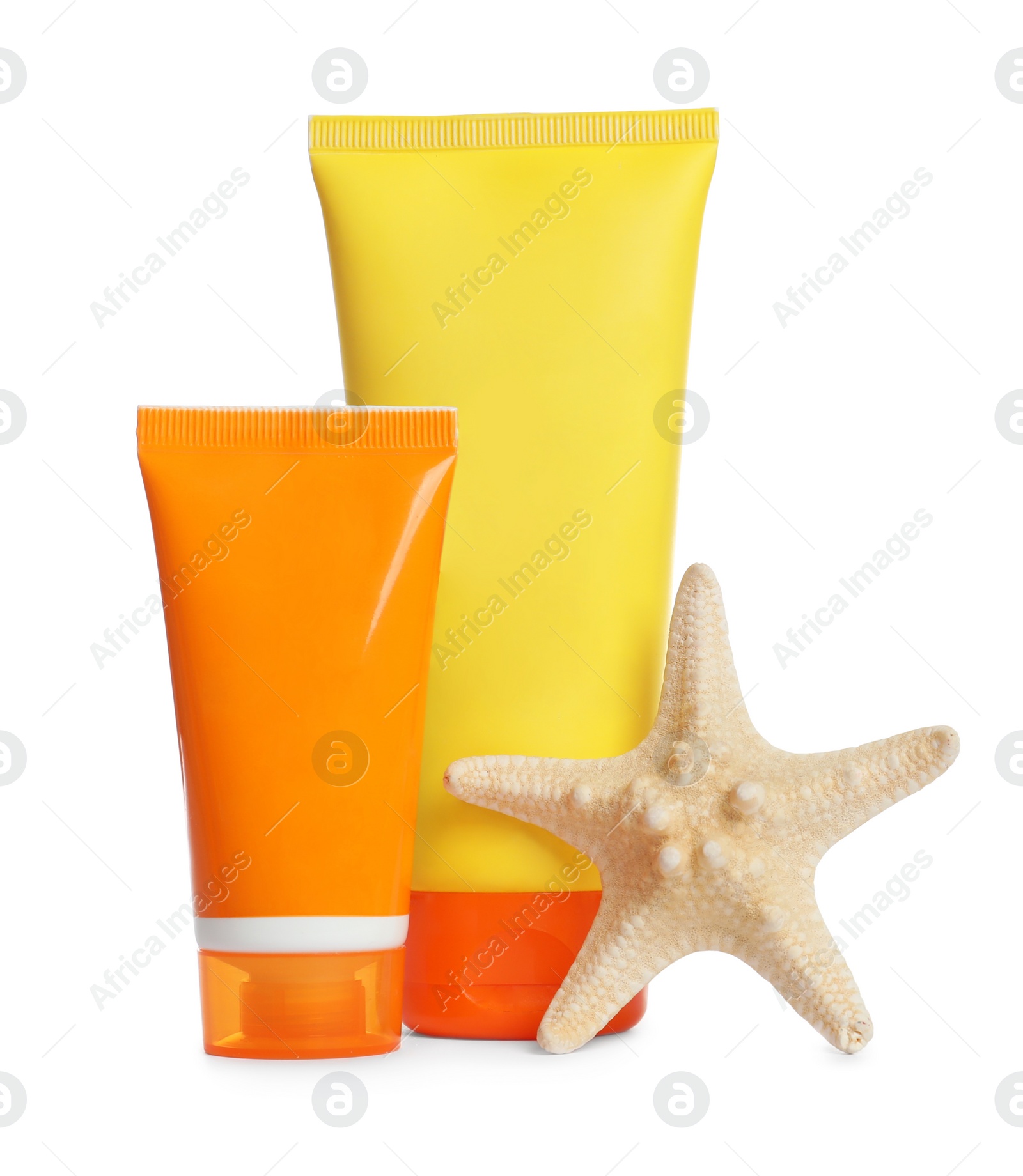 Photo of Tubes with sunscreen cream and starfish on white background. Cosmetic product