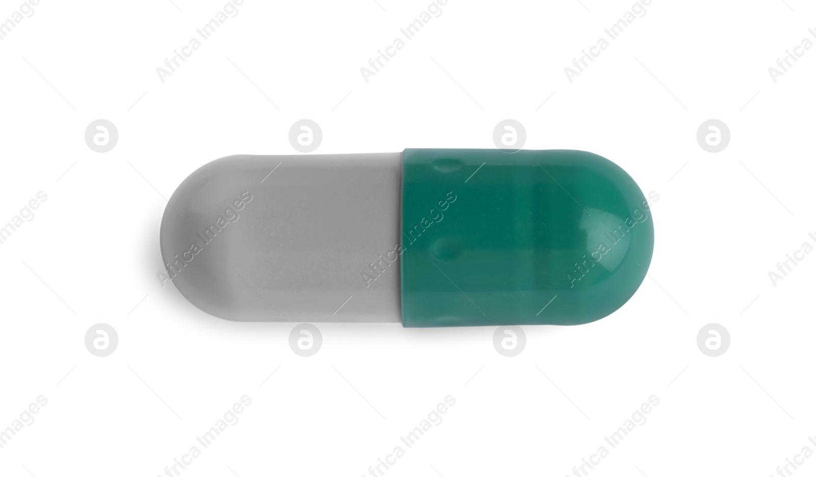 Photo of One pill isolated on white, top view