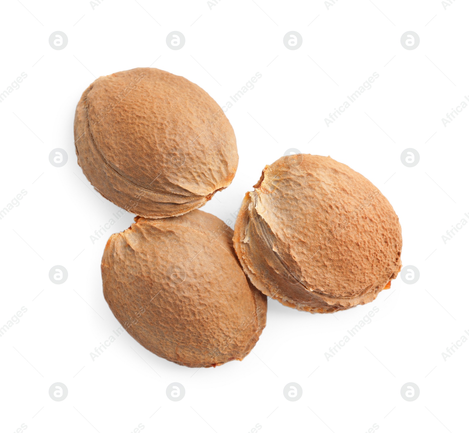 Photo of Organic dried apricot kernels on white background, top view