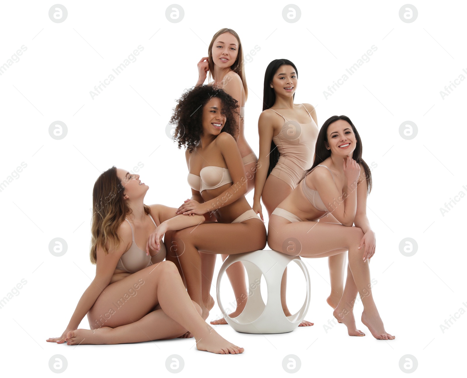 Photo of Group of women with different body types in underwear on white background