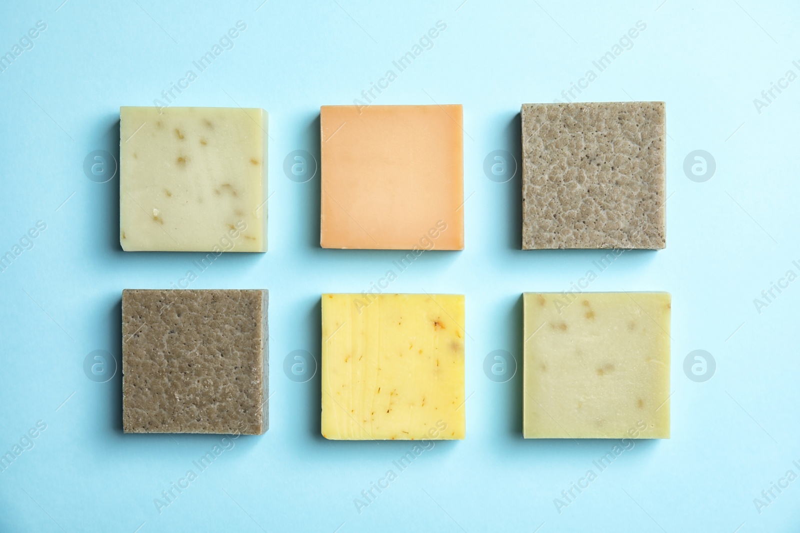 Photo of Hand made soap bars on color background, top view