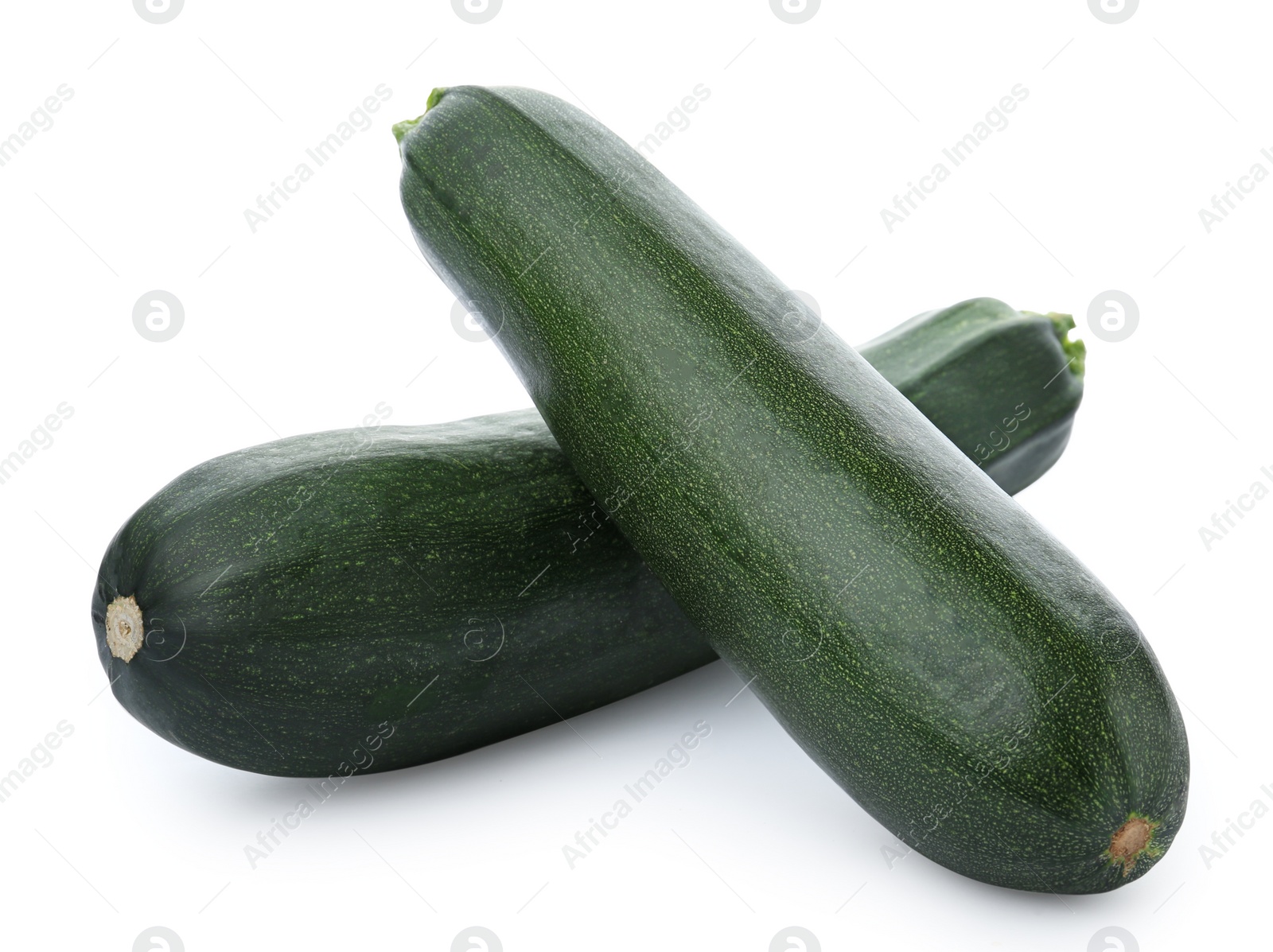 Photo of Fresh ripe green zucchinis on white background