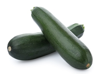 Fresh ripe green zucchinis on white background