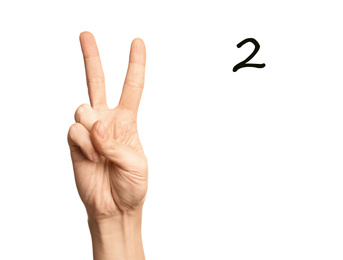 Image of Woman showing number two on white background, closeup. Sign language