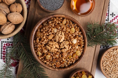 Photo of Flat lay composition with tasty traditional kutia on table