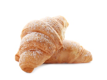 Tasty croissants with sugar powder on white background