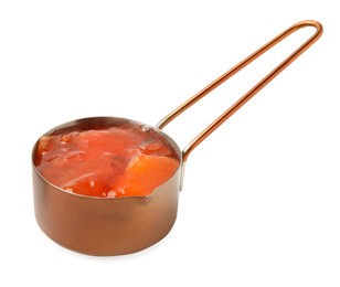 Photo of Saucepan of tasty persimmon jam isolated on white