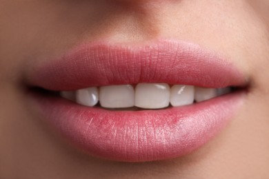 Photo of Young woman with beautiful lips, closeup view