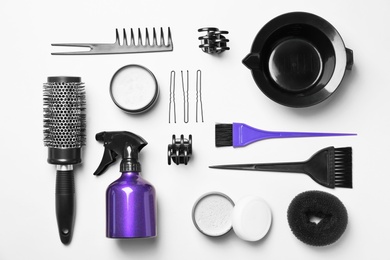 Photo of Professional hairdresser set on color background