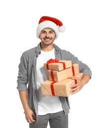 Young man with Christmas gifts on white background