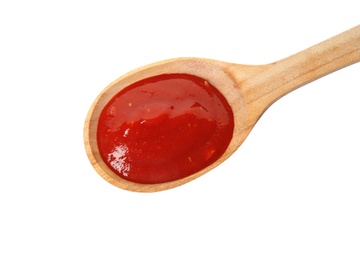 Photo of Spoon of tasty tomato sauce isolated on white, top view